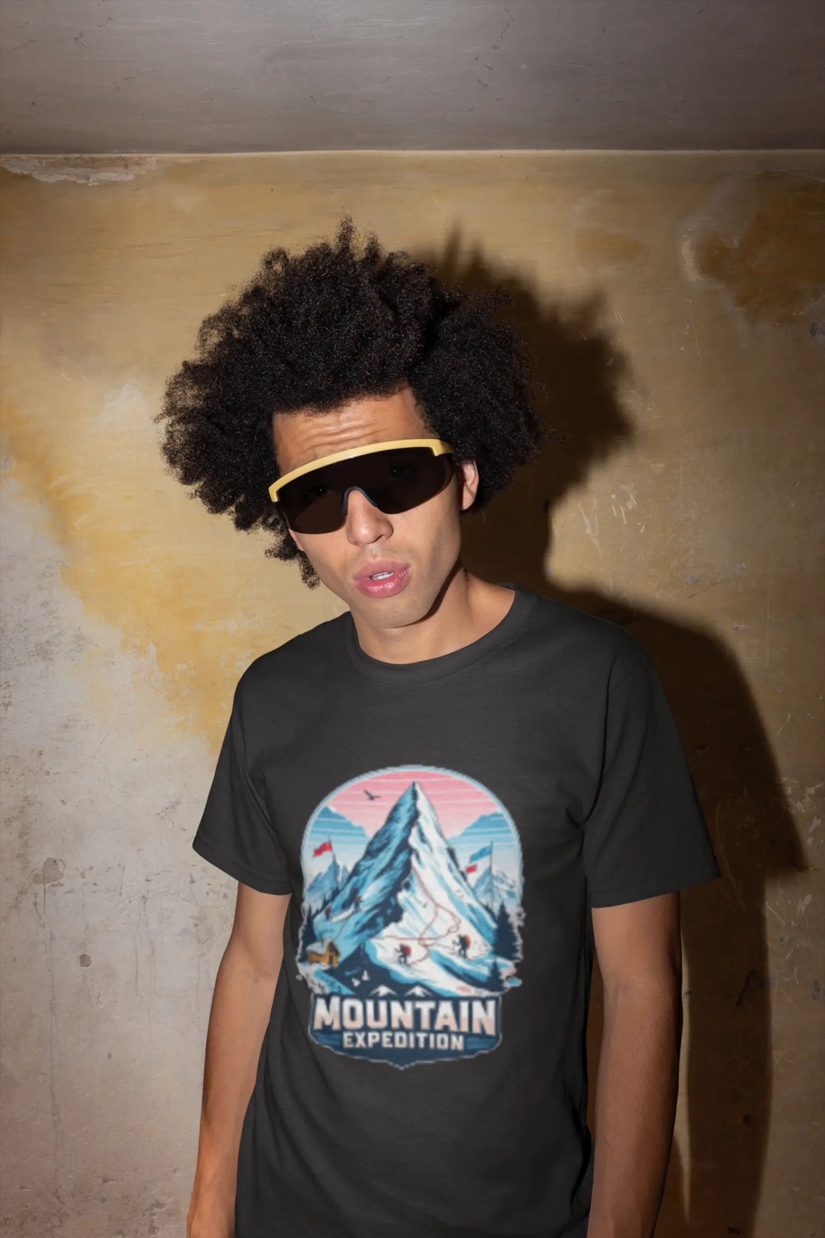 t-shirt-mockup-featuring-a-man-with-sunglasses-against-a-stained-wall